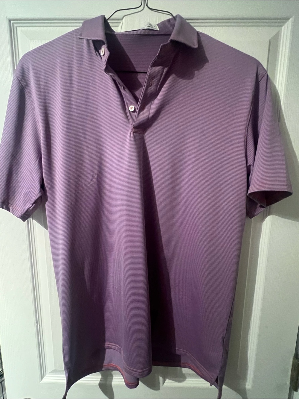 Blue and pink striped polo